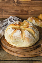 Fresh bread on wooden table