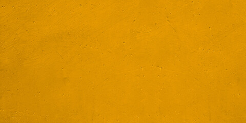 Urban background rusty cement or stone painting of gold yellow.