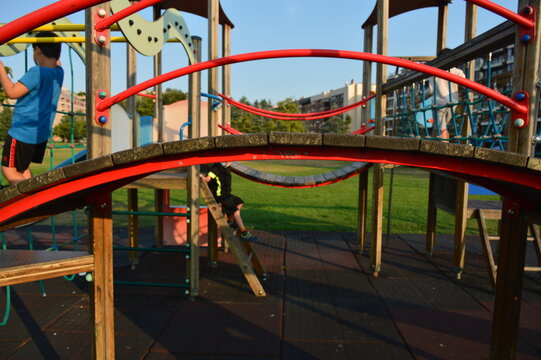 Children playing in a playground castle