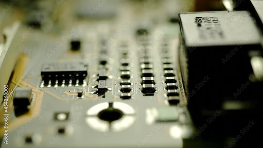 Poster components soldered on the surface of printed circuit board. macro, rack focus
