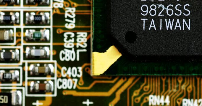 Macro Shot Of Surface Mount Component Of A Printed Circuit Board. sliding shot