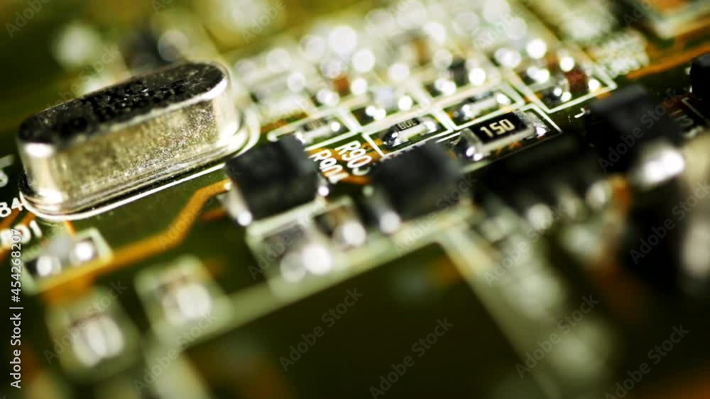 Poster macro shot of a computer motherboard with electronic components. rack focus