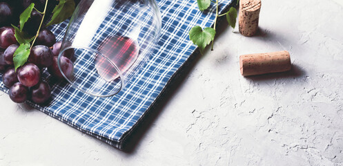 Wine and grape сomposition, vinery background, internet banner. Glass of red wine, black grapes...