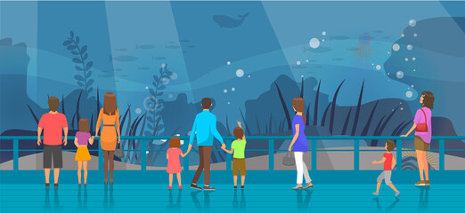 People watching underwater scenery with sea animals in oceanarium. Underwater fauna with fish, seaweed, whale, jellyfish. Marine world representatives. Oceanarium visitors look at fish in aquarium