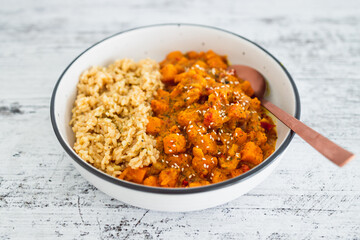 vegan pumpkin and bel pepper curry with brown rice, healthy plant-based food
