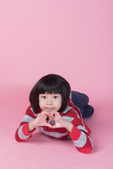 cute girl on pink background, asian kid
