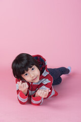 cute girl on pink background, asian kid
