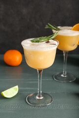 Glass of tasty whiskey sour cocktail on table