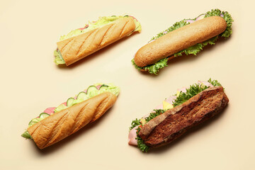 Tasty sandwiches on color background