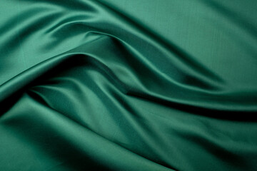 green fabric texture background, abstract, closeup texture of cloth
