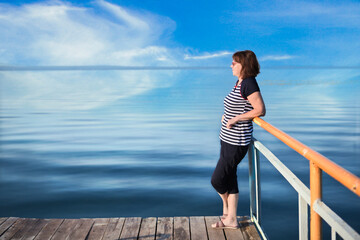 woman standing on pier