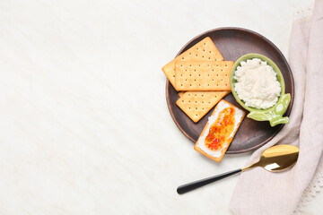 Delicious breakfast with crackers and jalapeno pepper jam on light background