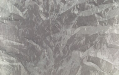 Texture. Old silvery crumpled fabric