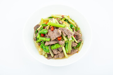 Stir-fried beef with celery on a dish on white background