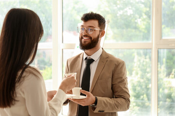 Business people having coffee break in office