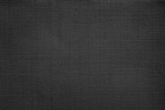 Jute hessian sackcloth canvas woven texture pattern background in light black color blank empty.