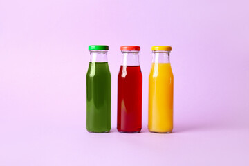 Different healthy juice on color background