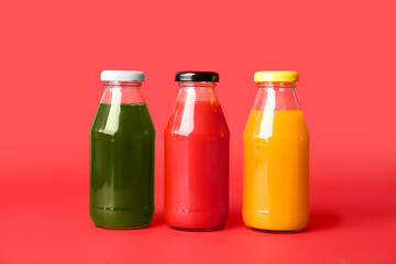 Different healthy juice on color background