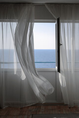 open window overlooking the sea