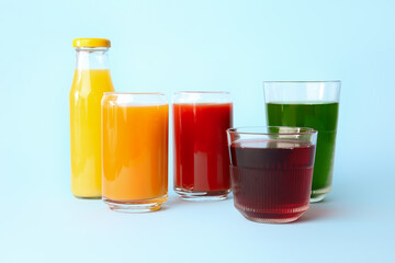 Fototapeta na wymiar Different healthy juice on color background