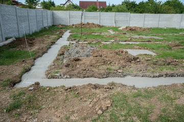 Concrete foundation in the ground prepare to build walls