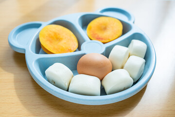 Steamed buns, eggs, fruits, breakfast for children