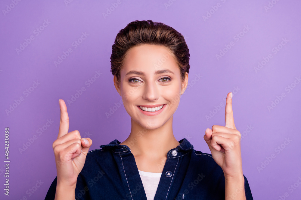 Poster Photo of sweet brunette young lady point empty space wear jeans shirt isolated on violet color background