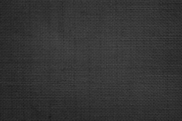 Jute hessian sackcloth canvas woven texture pattern background in light black color blank empty.