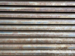 Fine details of rusted steel grating.