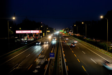 Fototapeta na wymiar Traffic flow on roads and highways at night