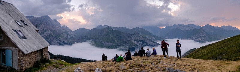 Fototapeta na wymiar hikers enjoying the scenery, Espuguettes refuge, Pyrenees National Park, Hautes-Pyrenees, France