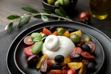 Buffalo mozzarella or burrata cheese with tomatoes and olivesl italian food, caprese salad