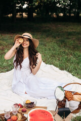 Attractive young lady posing near tree in the park