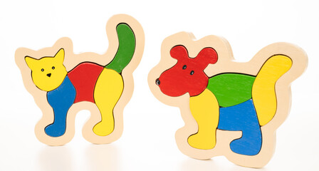 Wooden cat and dog puzzle on white background
