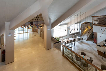 Above view to a hotel entrance lobby with marble floor