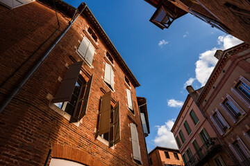 Fototapeta na wymiar View towards the sky. Albi old town red brick buildings.