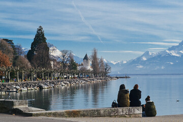 Small village by Geneva Lake with Swiss alps on the back