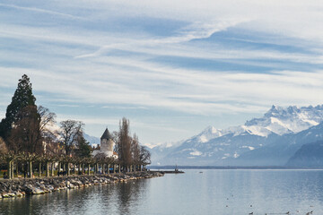 Small village by Geneva Lake with Swiss alps on the back