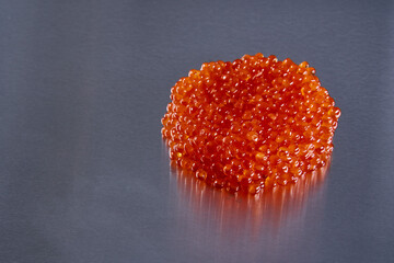 Salmon roe on metal