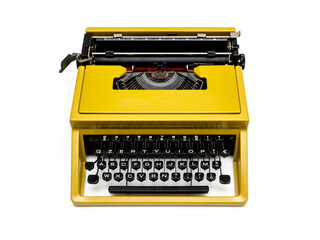 Vintage mustard yellow typewriter on a white background