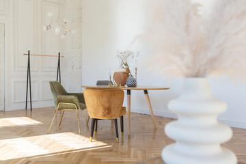 expensive modern light luxury interior design of a spacious living room with wooden elements and white walls. filled with original and unusual decorative things