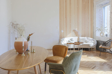expensive modern light luxury interior design of a spacious living room with wooden elements and white walls. filled with original and unusual decorative things