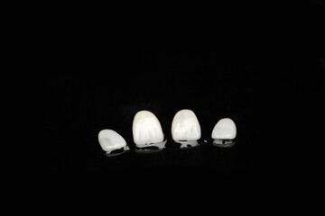 Checking the thickness of dental veneers.