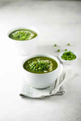 Healthy green pea soup with cream