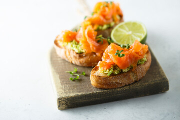 Homemade salmon bruschetta with avocado