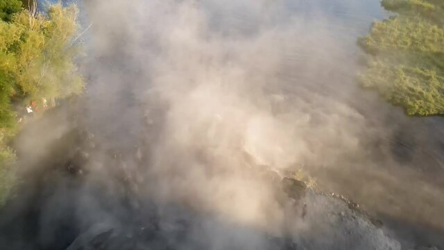 Domestic buffalos crossing a lake in the Kayseri city. Buffaloes bathing in river, Buffaloes natural habitat in Turkey.