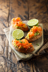 Homemade salmon bruschetta with avocado
