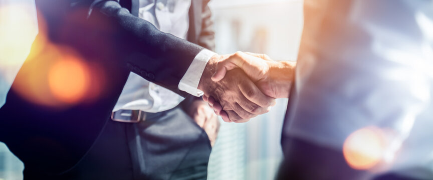 Businessman handshake for teamwork of business merger and acquisition,successful negotiate,hand shake,two businessman shake hand with partner to celebration partnership and business deal concept
