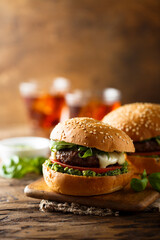 Traditional homemade beef burgers with pesto sauce