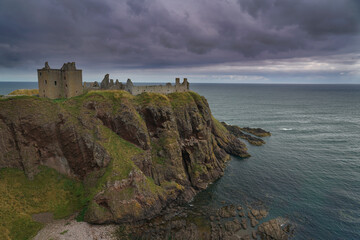 Fototapeta na wymiar Dramatic view of Dunnotar castle located in Aberdeenshire, Scotland.
